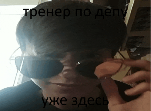 a man wearing sunglasses talks on a cell phone in a foreign language