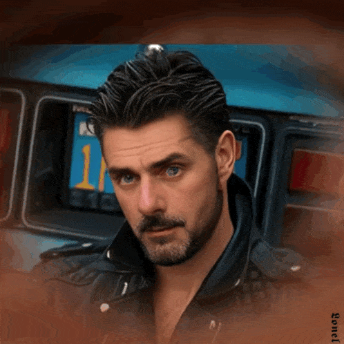 a man with a beard is wearing a black leather jacket with the number 1 on the back