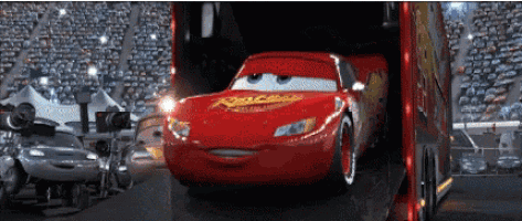 a lightning mcqueen from cars is being loaded into a trailer