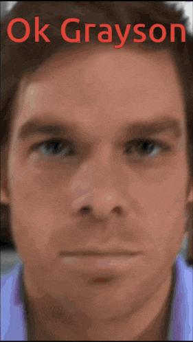a close up of a man 's face with the words ok grayson written above it
