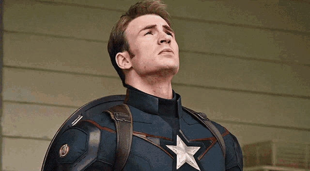 a man in a captain america costume with a star on his chest