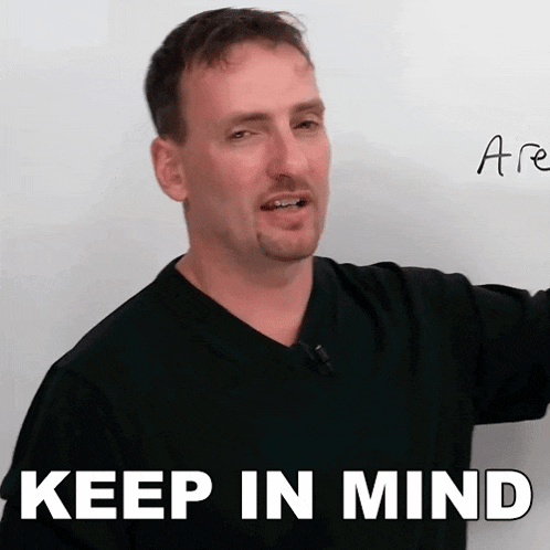 a man stands in front of a white board with the words " keep in mind " written on it