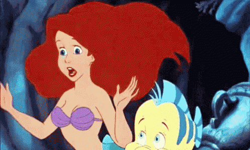 ariel from the little mermaid is standing next to flounder from the little mermaid .