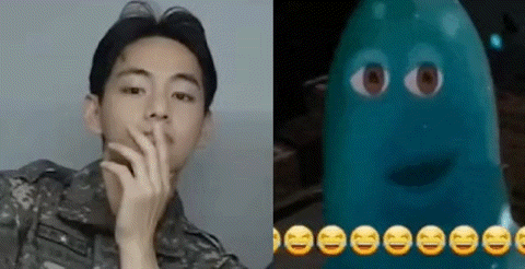 a man in a military uniform is smoking a cigarette next to a picture of a cartoon character with smiley faces .