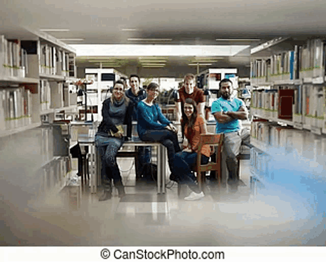 a group of students posing for a picture in a library