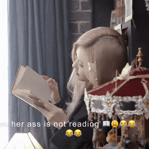 a picture of a woman reading a book with the caption " her ass is not reading "