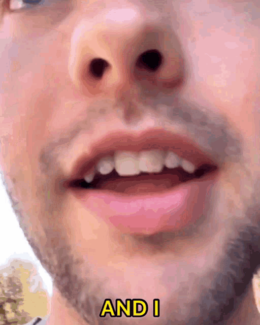 a close up of a man 's mouth with the words " and i " visible