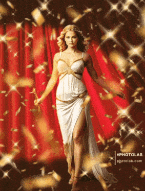 a woman in a white dress is standing in front of a red curtain with gold confetti flying around her