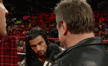 a man in a leather jacket with the word wrestling on it