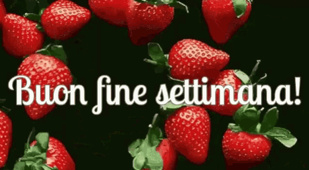a bunch of strawberries with the words buon fine settimana in white letters