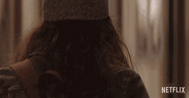 a close up of a person 's back with a netflix logo in the corner