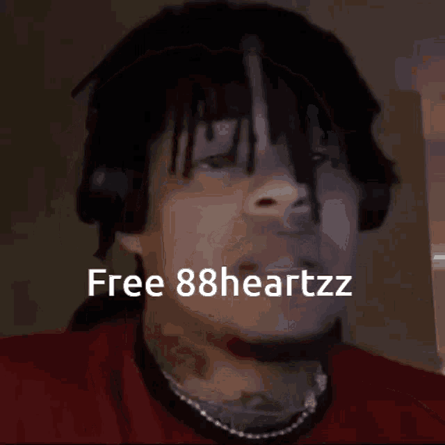 a man wearing headphones with the words free 88heartzz on the bottom