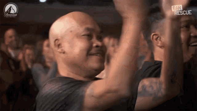 a man in a crowd with his arms in the air and the words bar rescue on the bottom right