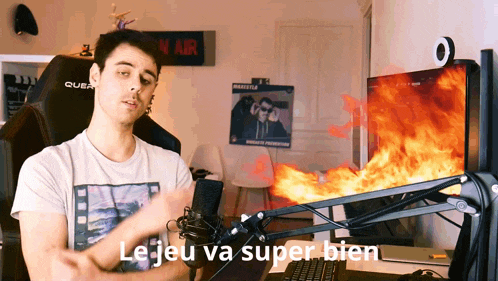 a man standing in front of a microphone with the words le jeu va super bien written on the bottom