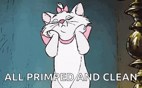 marie from the aristocats is covering her face with her paws and the words `` all primped and clean '' are written below her .