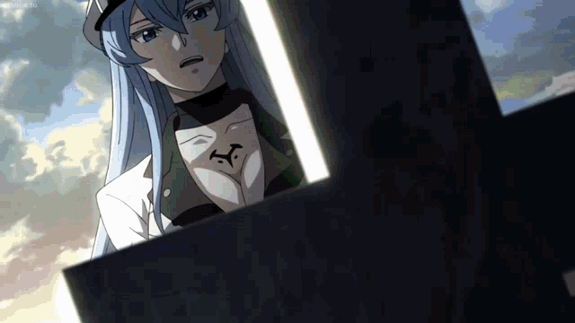 a woman with long blue hair has a tattoo on her chest that says ' x '