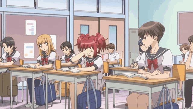 a group of students are sitting at desks in a classroom with one girl covering her eyes