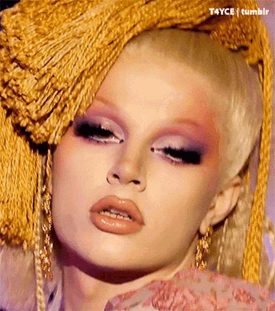 a close up of a woman 's face with t4yce tumblr written in the corner