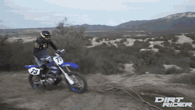 dirt rider shows a person riding a dirt bike in the desert