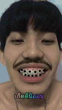 a man with a mustache and braces on his teeth has a smiley face