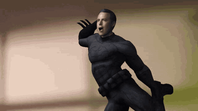 a man in a black superhero costume is waving