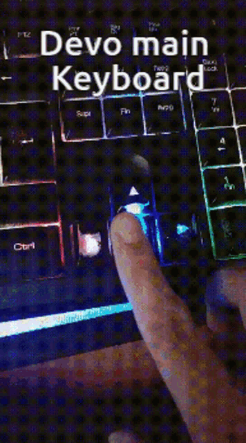 a person is typing on a keyboard with the words devo main keyboard written above it