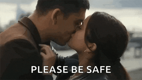 a man and a woman are kissing and the woman is asking the man to be safe .