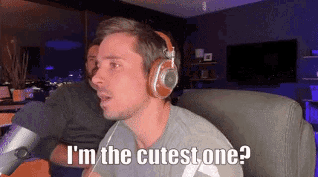 a man wearing headphones says " i 'm the cutest one ? "