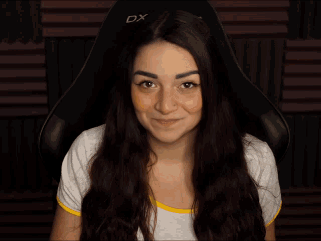 a woman sitting in a dxr4t chair making a funny face