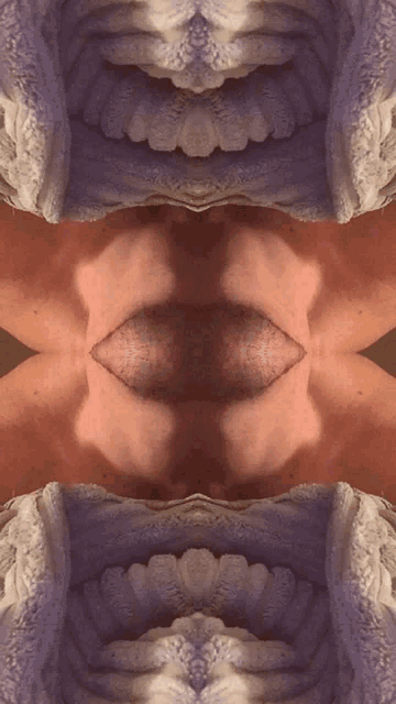 a close up of a person 's face with a kaleidoscope effect on it