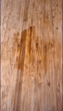 a close up of a wooden surface with a few lines