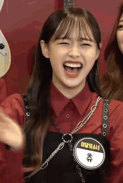 a girl wearing a name tag that says kwon on it