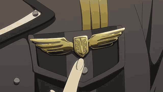 a person 's hand is reaching for a badge with the letter e on it