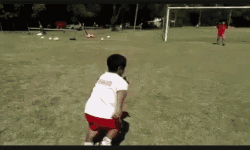 a blurry picture of people playing soccer in a field