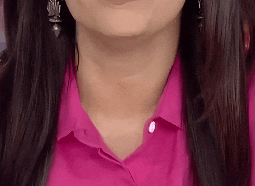 a close up of a woman 's neck and collar