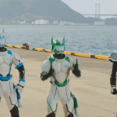 a man in a white and green robot costume with the word shark on his pants
