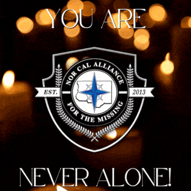 a poster that says you are never alone with candles in the background