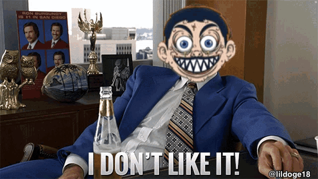 a man in a suit and tie says i don 't like it while holding a bottle