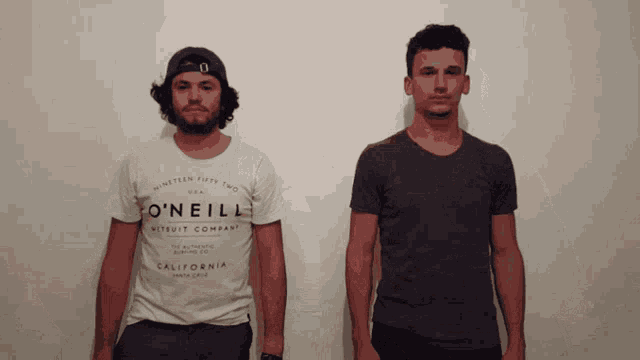 two men are standing next to each other one wearing a o'neill shirt