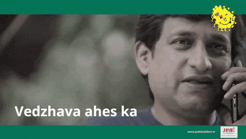 a man is talking on a cell phone and the words vedzhava ahes ka are below him