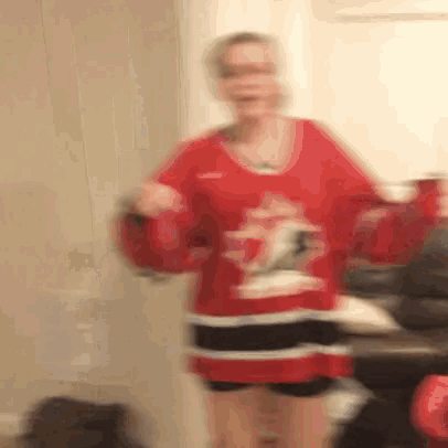 a blurry picture of a woman wearing a red jersey