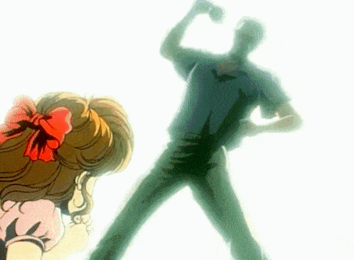 a girl with a red bow in her hair looks at a man