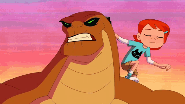 a girl in a blue shirt with a cat on it sits next to a monster