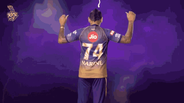 a man wearing a jersey with the number 74 on the back
