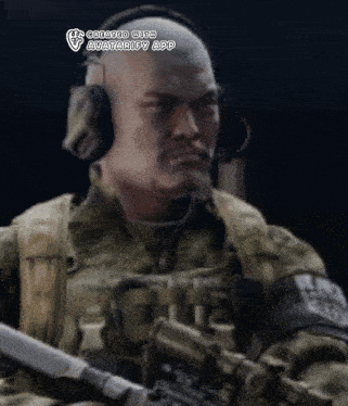a bald soldier wearing headphones and holding a rifle ..