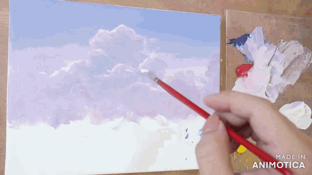 a person is painting a cloudy sky with a brush and the words made in animotica on the bottom right