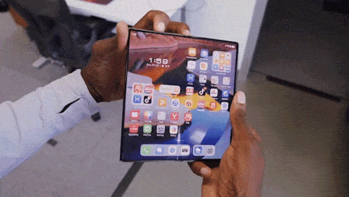 a person is holding a phone that says 1:58 on it