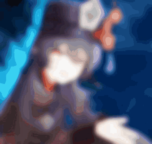 a blurry picture of a person 's face with a tear coming out of their eye