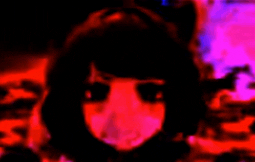 a close up of a girl 's face with a cat ear in a red and pink background .