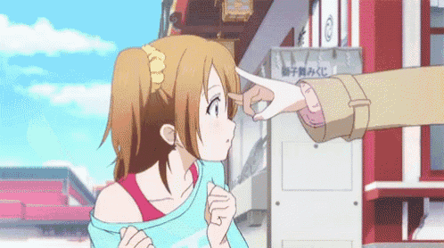 a person pointing at a girl 's face in front of a sign that says ' lucky ' on it